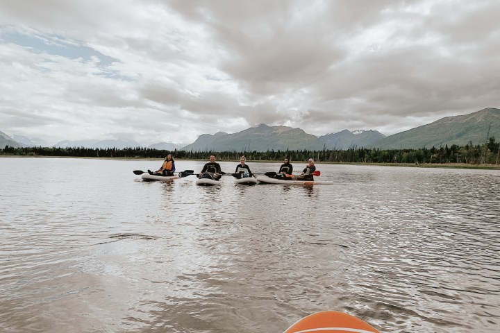 a group of people on a kayaks in Alaska