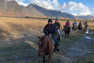 Horseback riders on a trail in Alaska